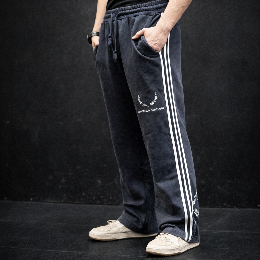 Men wearing navy Conviction Strength joggers with white side stripes and laurel logo